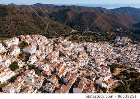 Aerial view of Ojen, white village over a hillside near Marbella, Spain in the spring Aerial view of Ojen, white village over a hillside near Marbella, Spain in the spring 96539251