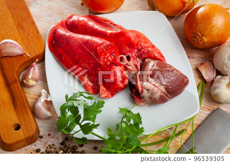 Raw lamb lungs and heart served with greens, nobody Raw lamb lungs and heart served with greens, nobody 96539305