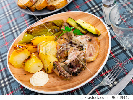 Rabbit meat prepared with vegetables Rabbit meat prepared with vegetables 96539442