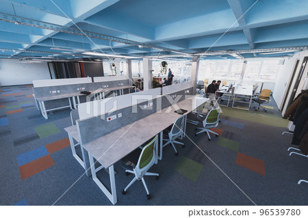 Photo of a modern office where programming, digital marketing and web design projects are done. Office with modern furniture and glass office 96539780