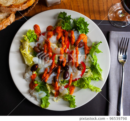 Traditional catalan salad Xatonada with crumbled cod 96539798