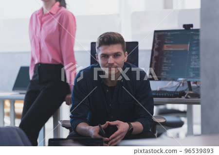 Programming. Man Working On Computer In IT Office, Sitting At Desk Writing Codes. Programmer Typing Data Code, Working On Project In Software Development Company Programming. Man Working On Computer In IT Office, Sitting At Desk Writing Codes. Programmer Typing Data Code, Working On Project In Software Development Company 96539893