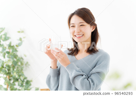 A woman drinking water A woman drinking water 96540293