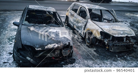 damaged cars in the city Parking lot on winter day damaged cars in the city Parking lot on winter day 96540401
