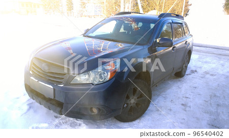 close up.dark blue car in the city Parking lot on a winter day close up.dark blue car in the city Parking lot on a winter day 96540402