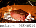 Wagyu beef block grilled on a bonfire 96540519