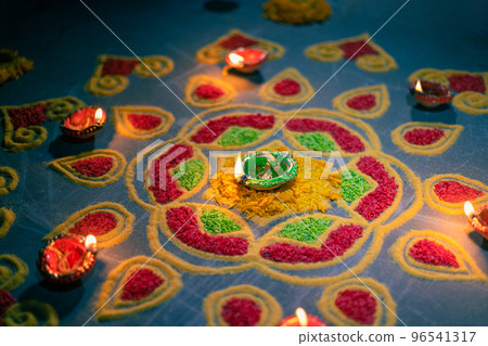 Happy Diwali - Diya lamps lit during diwali celebration Happy Diwali - Diya lamps lit during diwali celebration 96541317