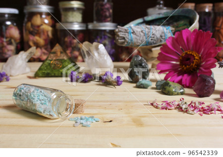 Incense Cones on Stone Slab With Crystals and Flowers 96542339