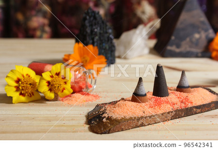 Rock Crystal With Incense and Stone Pyramid on Meditation Altar 96542341