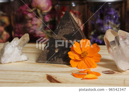 Quartz Crystals and Stone Pyramid With Flower. Relaxation and Meditation Decor 96542347