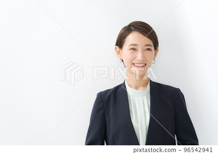 A woman in a suit White background A woman in a suit White background 96542941