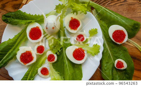 background of red caviar on dsrk wooden surface. tartlets with red caviar 96543263
