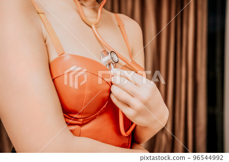 Young woman in red corset and black leather... - Stock Photo [96544992] -  PIXTA