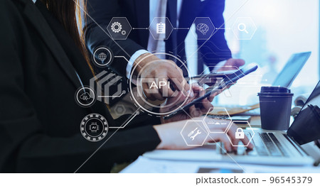 API - Application Programming Interface, woman using laptop, tablet and smartphone with virtual screen API icon Software development tool, modern technology API - Application Programming Interface, woman using laptop, tablet and smartphone with virtual screen API icon Software development tool, modern technology 96545379