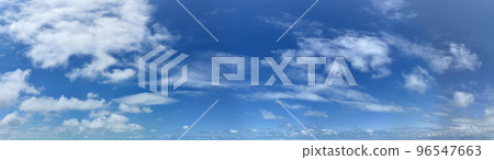 Panorama of a blue sky with white cumulus clouds as a backround 96547663