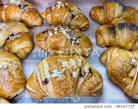 Fresh croissant bread on buffet line. Fresh pastry. 96547747