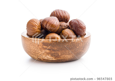 Peeled chestnuts. Sweet roasted chestnuts in bowl isolated on white background. 96547803