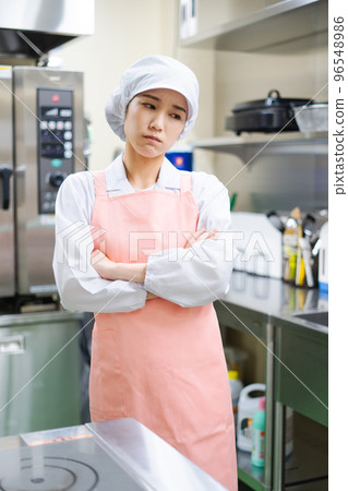 Young female cook (anxiety) 96548986
