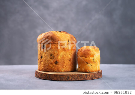Panettone is the traditional Italian Milan sweet bread for Christmas on a gray background Panettone is the traditional Italian Milan sweet bread for Christmas on a gray background 96551952