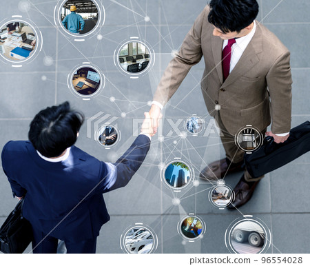 Two businessmen shaking hands 96554028