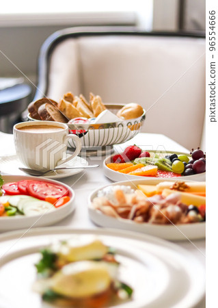 Luxury hotel and five star room service, various food platters, bread and coffee as in-room breakfast for travel and hospitality brand 96554666