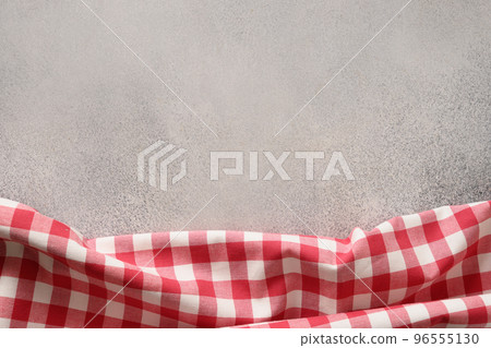 Kitchen gray table top with red checkered towel. Top view. 96555130