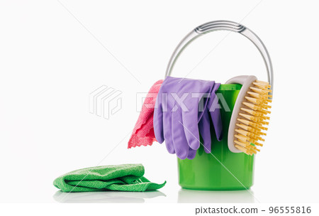 Household Cleaner tools and sundry items Spring cleaning kitchen, bathroom and other rooms. on white. Cleaning and janitorial service concept. Green and vibrant violet. Bucket with gloves and dusters 96555816