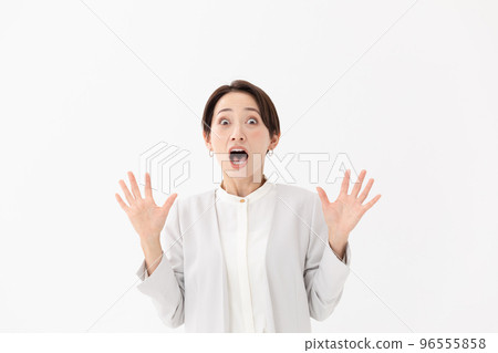 Surprised woman white background 96555858