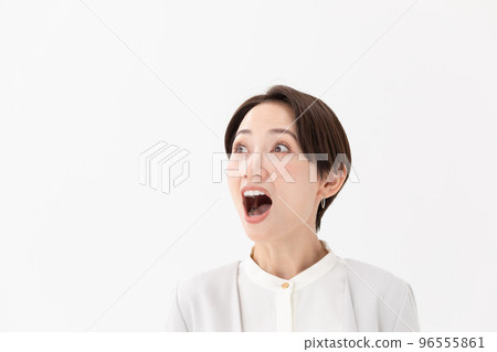Surprised woman white background 96555861