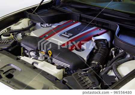 The engine room of a rear-wheel drive vehicle with a vertically mounted V6 gasoline engine 96556480