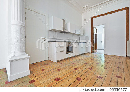 Empty apartment with modern kitchen and designed hardwood 96556577