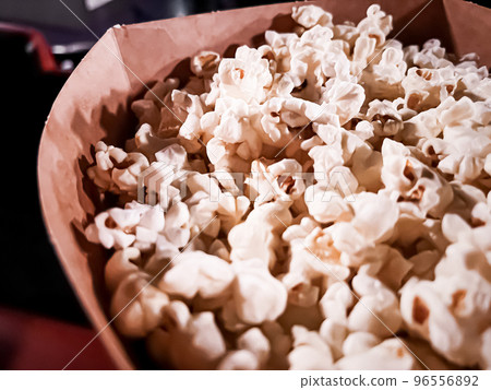 Cinema and entertainment, popcorn box in the movie theatre for tv show streaming service and film industry production branding Cinema and entertainment, popcorn box in the movie theatre for tv show streaming service and film industry production branding 96556892