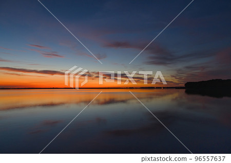 sunset sky over lake 96557637