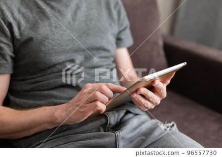 Point finger choose something on a tablet. Using technology. Point finger choose something on a tablet. Using technology. 96557730
