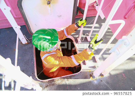 Offshore oil and gas industry and operated by technician petroleum. Worker walking to oil and gas plant for work as routine plan. Maintenance and Operation work scope in oil and gas plant. Offshore oil and gas industry and operated by technician petroleum. Worker walking to oil and gas plant for work as routine plan. Maintenance and Operation work scope in oil and gas plant. 96557825