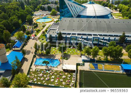 Top view of an outdoor place for people to relax where there is a swimming pool and a lot of sun beds 96559363