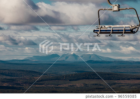 big mountain with snow on top and chairlift big mountain with snow on top and chairlift 96559385