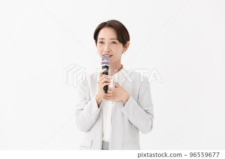 Woman holding a microphone White background 96559677