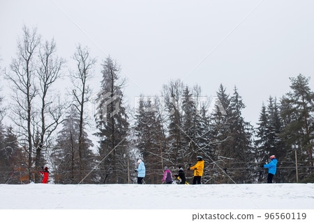 ski lift. funicular skiers and snowboards climb the hill of the mountain on the lift ski lift. funicular skiers and snowboards climb the hill of the mountain on the lift 96560119