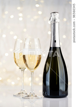 Champagne bottle and glasses 96560345