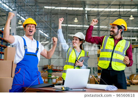 Group of Asian warehouse worker raise hands and action of happy from success in their project Group of Asian warehouse worker raise hands and action of happy from success in their project 96560618