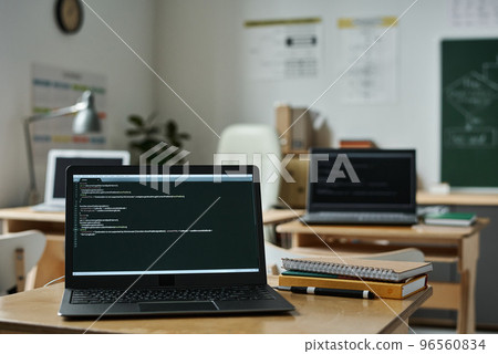Close-up of laptop on desk with new software on screen in classroom to study IT technology 96560834