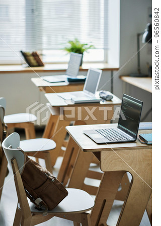 Vertical image of empty class with computers on desks for IT lesson 96560842