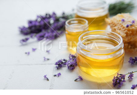 Jar with honey and fresh lavender flowers Jar with honey and fresh lavender flowers 96561052