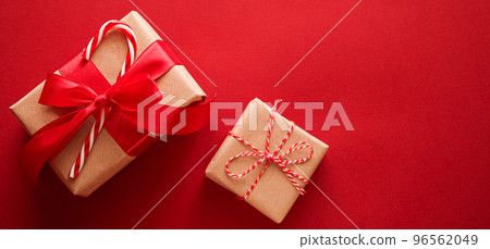 Christmas gifts, boxing day and traditional holiday presents flat lay, classic xmas gift boxes on red background, wrapped present with festive ornaments and decorations for holidays flatlay design Christmas gifts, boxing day and traditional holiday presents flat lay, classic xmas gift boxes on red background, wrapped present with festive ornaments and decorations for holidays flatlay design 96562049