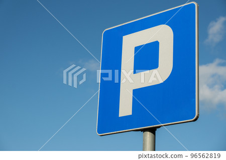 Parking sign showing free places. Traffic parking sign with clean sky and light ray. Cars became biggest problem for urban ecology due emission Parking sign showing free places. Traffic parking sign with clean sky and light ray. Cars became biggest problem for urban ecology due emission 96562819