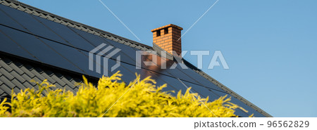 New ecologic house with solar panels Alternative to conventional energy. The battery is charged from a solar cell Advertisement Green energy Sustainable life Renewable  96562829