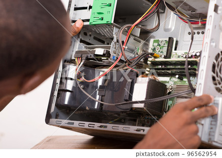 technician repairing computer equipment. 96562954