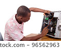 young technician repairing a computer 96562963
