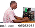 young technician sitting and repairing a desktop computer in fro 96562968